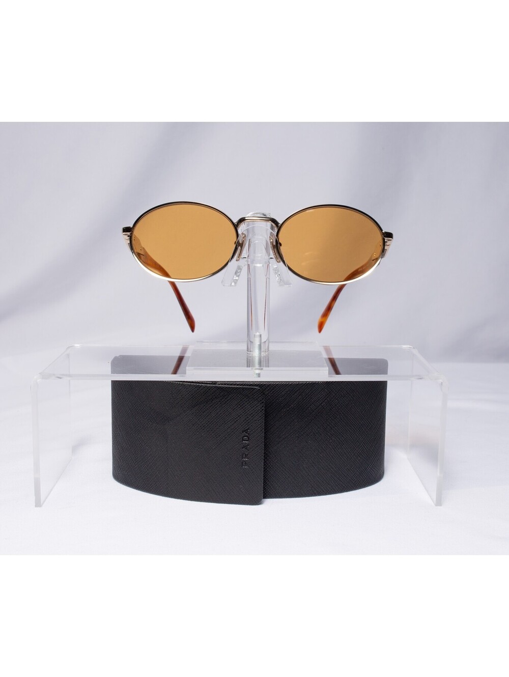 Prada Gold Tone Round Indoor Outdoor Brown